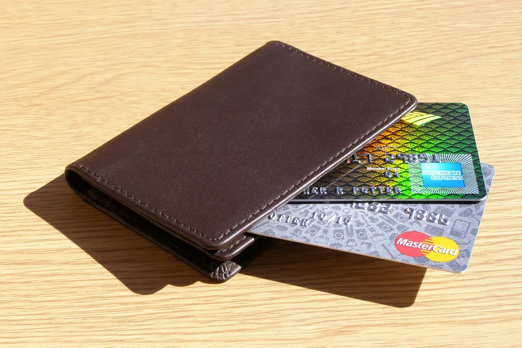 A wallet containing credit cards, illustrating available credit and card balances